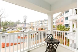 Balcony view of colorful apartment complex courtyard