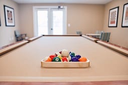 Racked billiard balls on indoor pool table