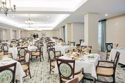 Elegant banquet hall with round dining tables