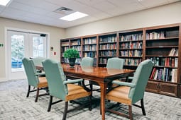 Library meeting room with table and bookshelves