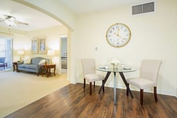 Modern dining area with glass table and chairs