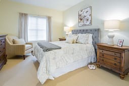 Cozy bedroom with tufted headboard and wooden nightstands