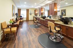 Modern hair salon with styling chairs and sinks