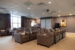 Cozy home theater with leather recliner seating