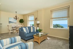 Cozy living room with ocean view windows