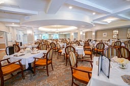 Elegant dining room with round tables and chandeliers
