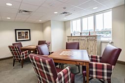 Game room with chess tables and plaid chairs