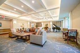 Elegant lounge with sofas and grand piano