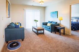 Modern living room with teal sofas and coffee table