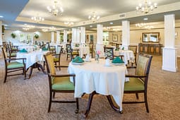 Elegant dining room with round tables and chandeliers