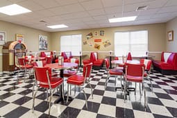 Retro diner interior with red booths and jukebox
