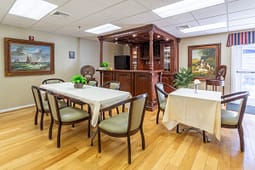 Cozy dining room with wooden bar cabinet