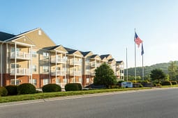 Apartment complex with balconies and American flag