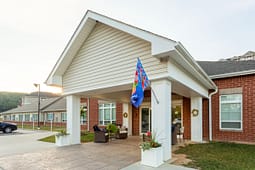 Brick residential building entrance with covered porch