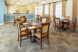 Bright dining room with wooden tables and chairs