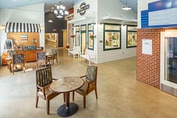 Cozy indoor community space with general store facade