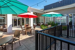 Outdoor patio with tables and colorful umbrellas
