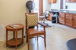 Modern salon interior with styling chair and dryer