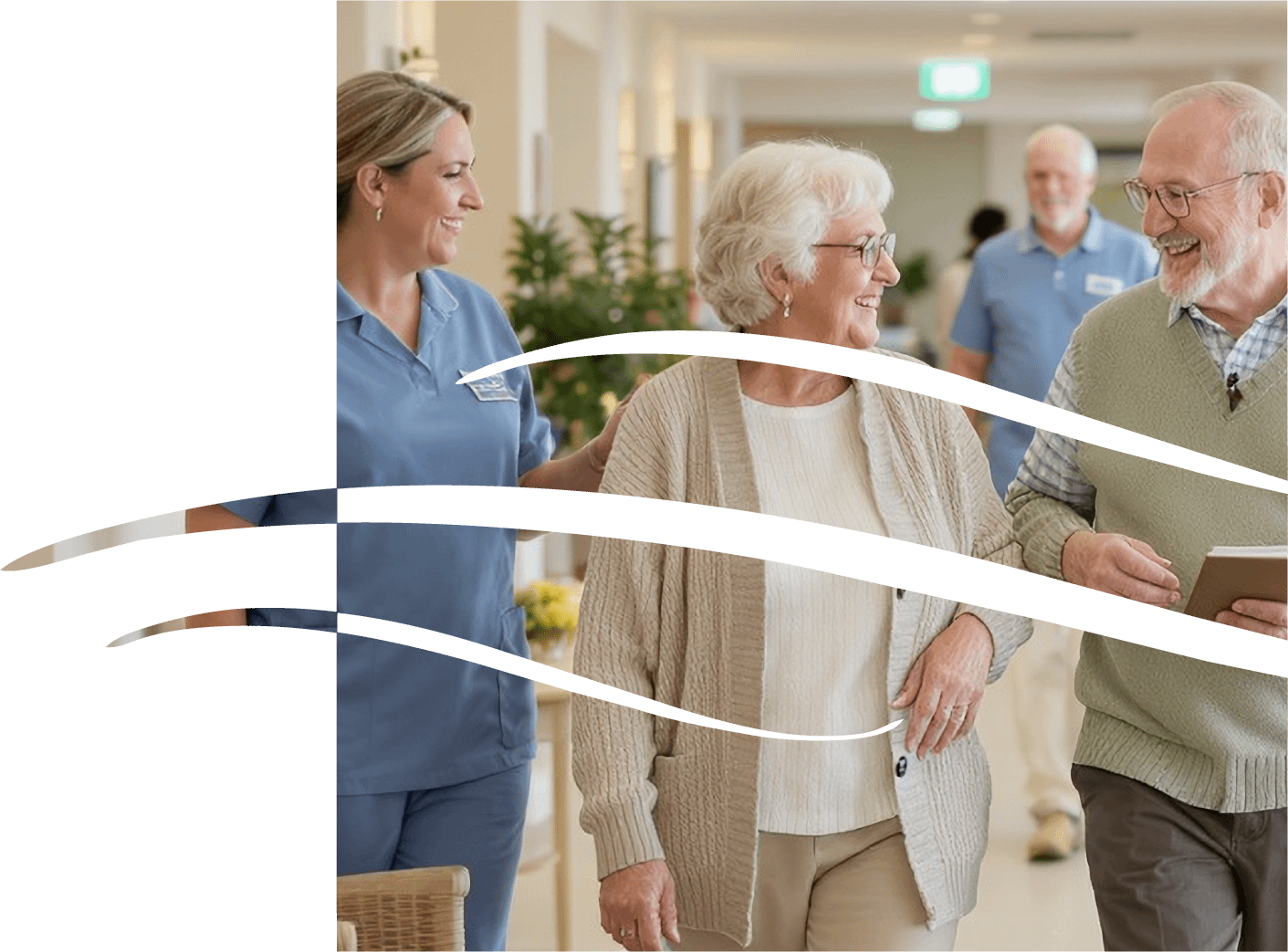 Caregiver walking with smiling elderly couple indoors