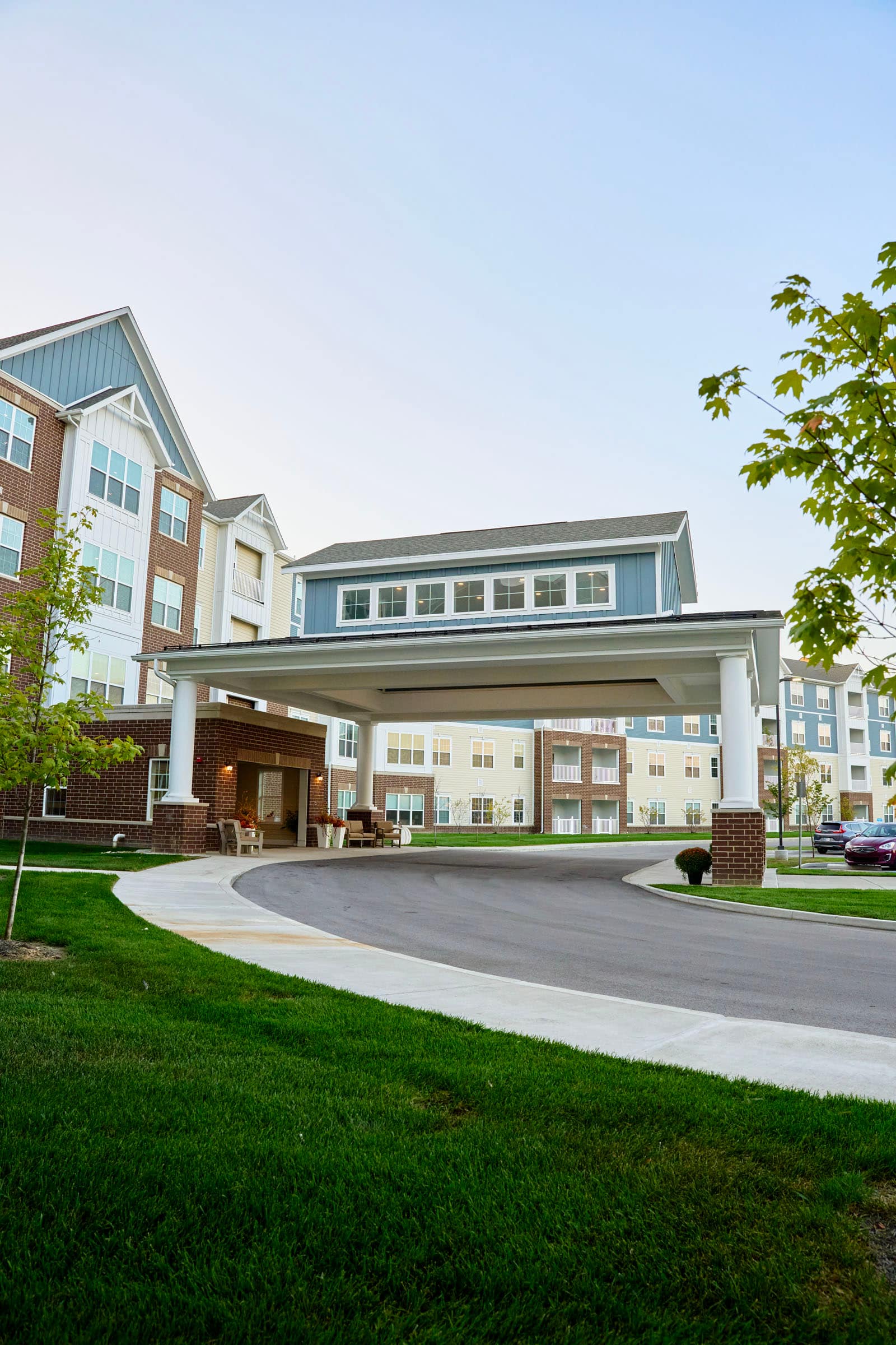 Modern apartment complex with covered entrance driveway