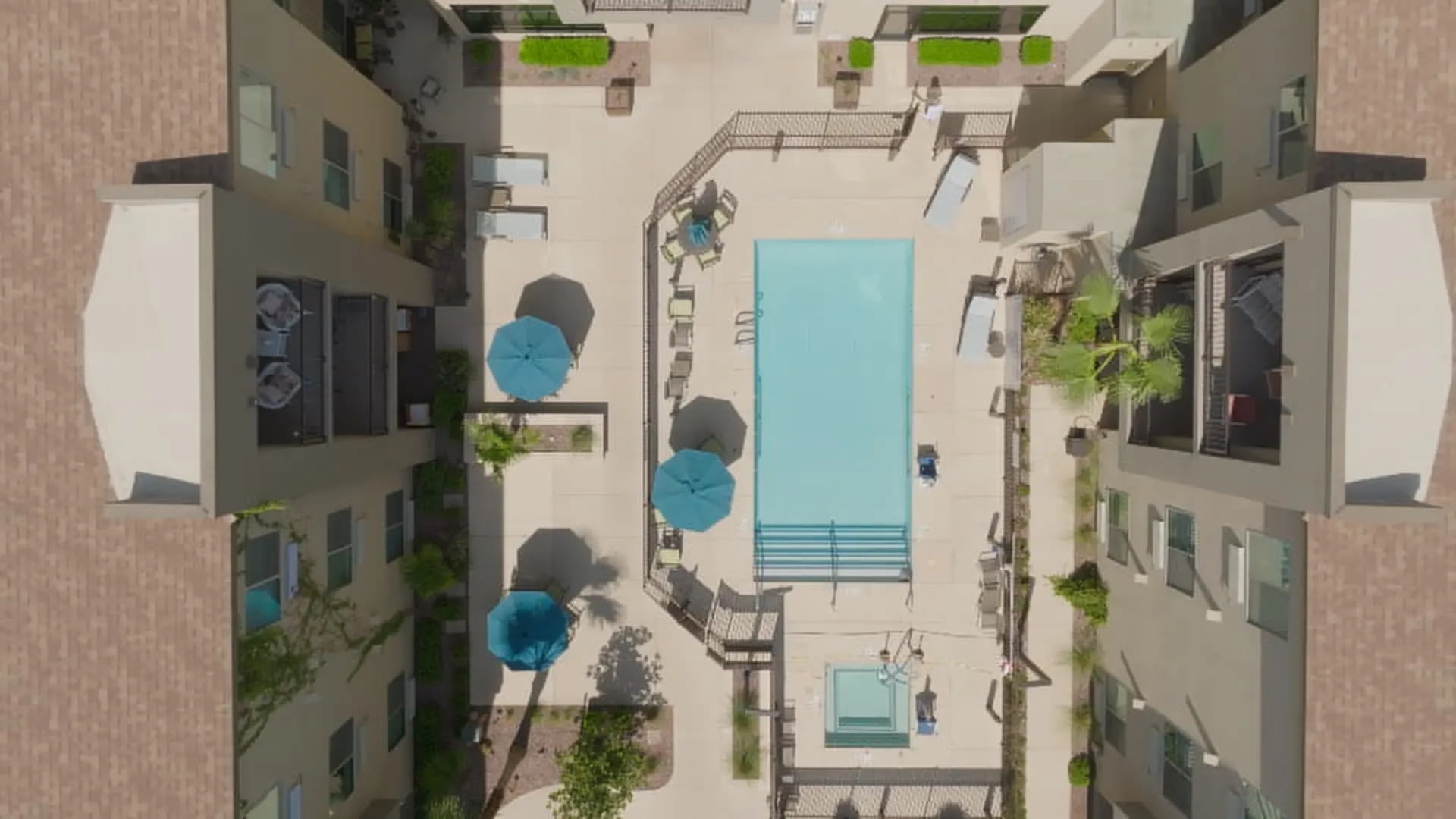 Aerial view of apartment courtyard with swimming pool