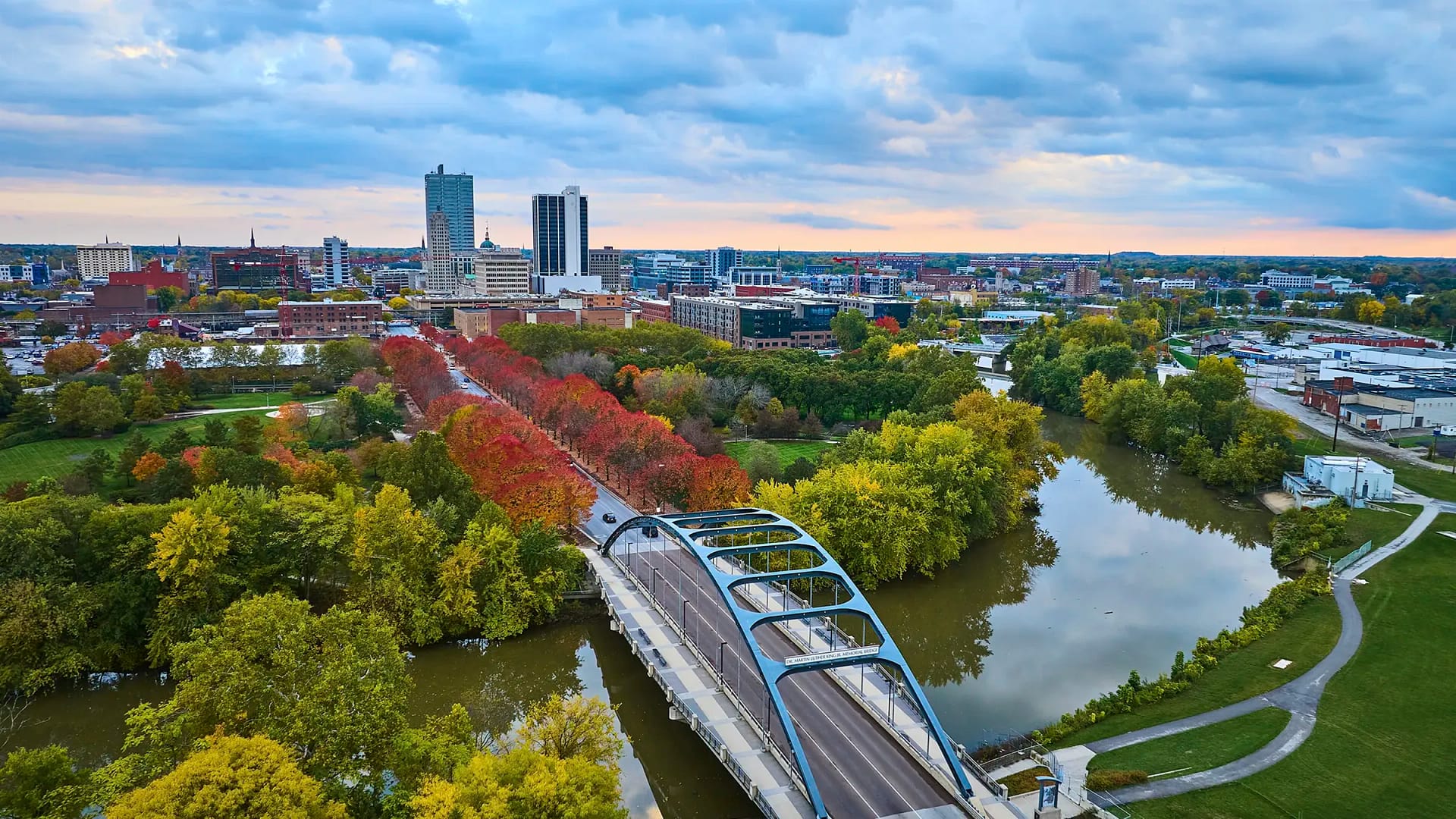 Aerial view of city skyline and river bridge