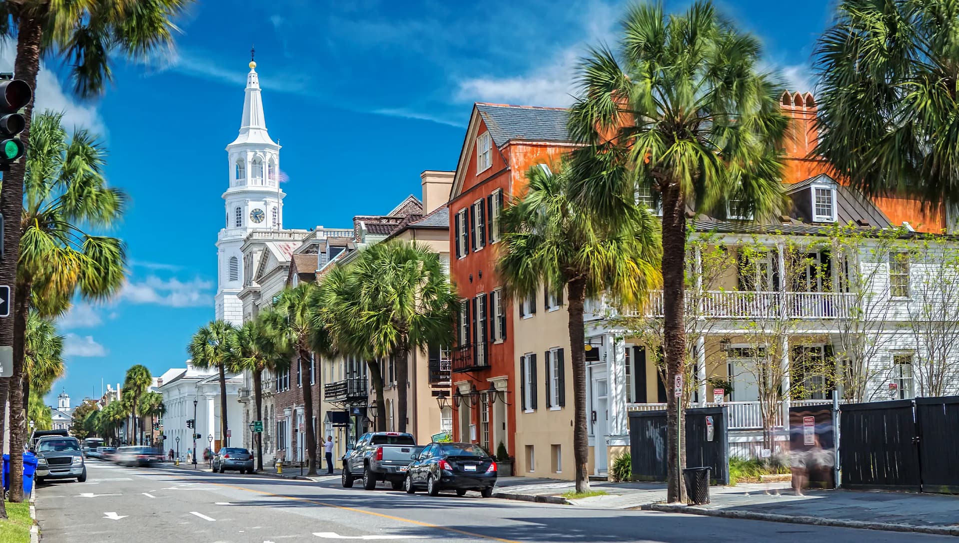 Sunny day along a charming, palm-lined historic district.