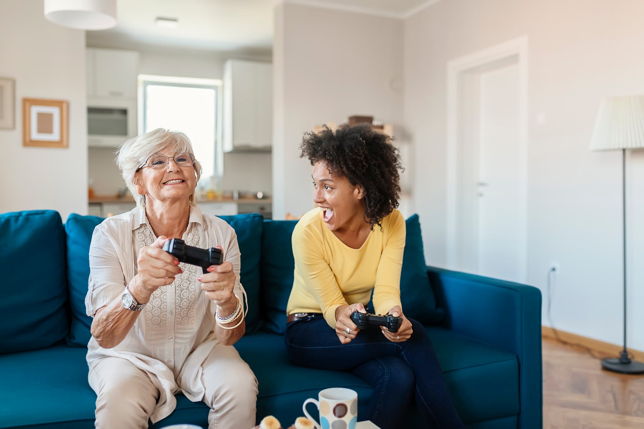 Mother and daughter playing video games
