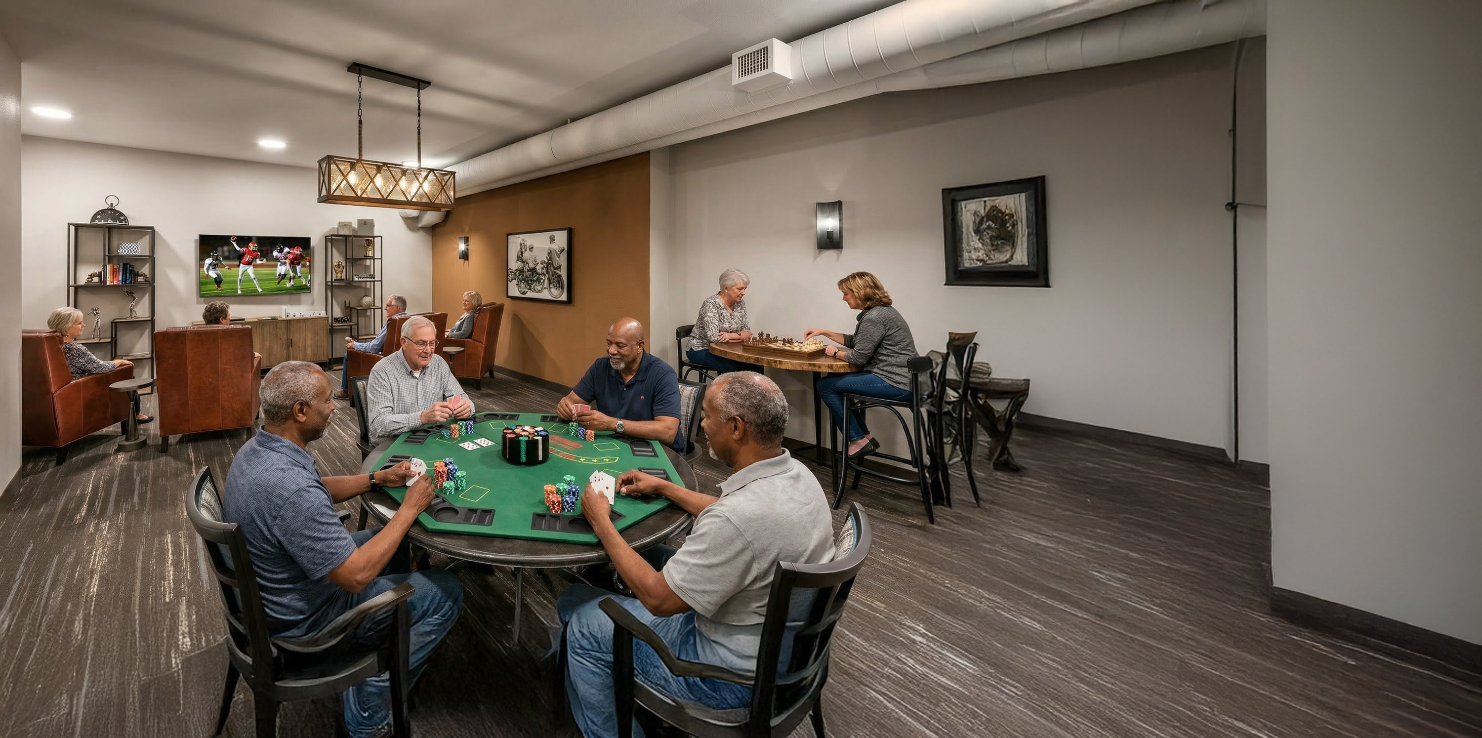Seniors playing poker and chess in community room