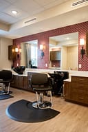 Modern hair salon with styling chairs and mirrors