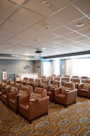 Cozy screening room with leather recliner chairs