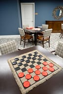 Checkers board on table in cozy game room