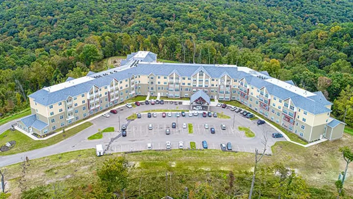 Aerial view of large residential building in forest