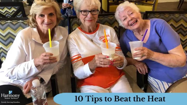 Three senior women enjoying cold drinks indoors
